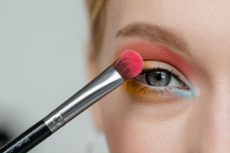 Applying eye makeup with a brush