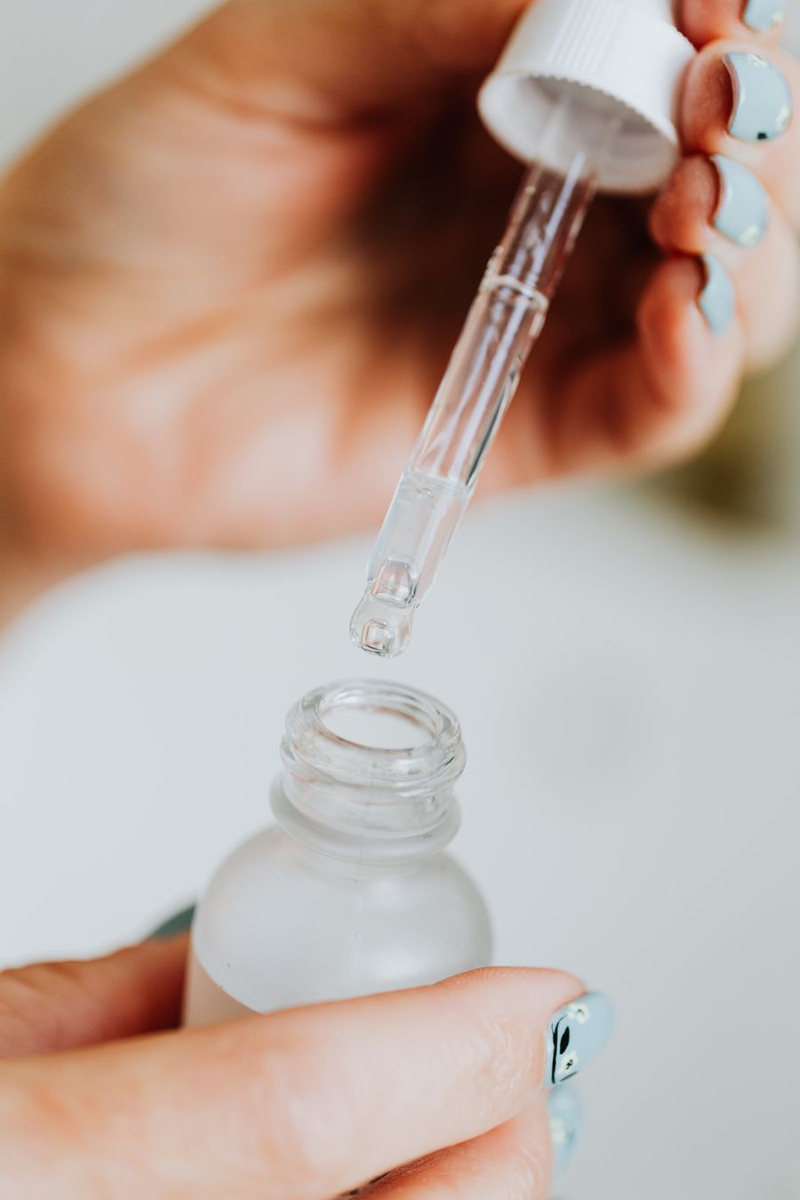 Applying serum from a frosted glass dropper